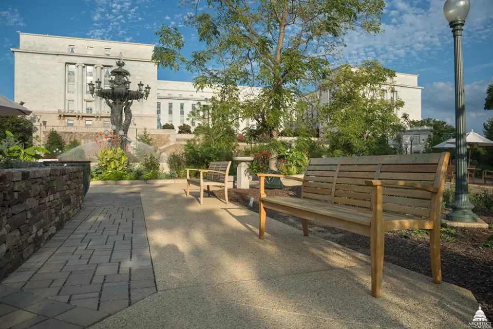 The park includes permeable pavement (left) and new furniture made from locally salvaged white oak.