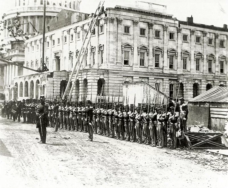 Civil War: Union soldiers stand at attention in front of the U.S. Capitol, 1861.