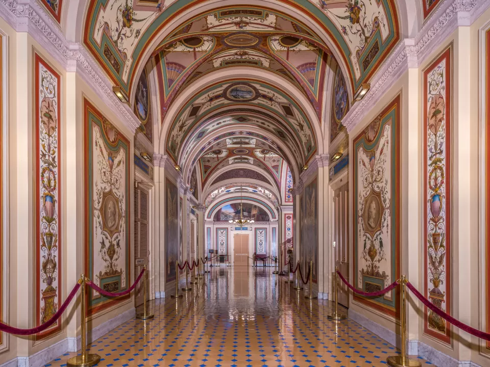 View down one hall of the Brumidi Corridors in the U.S. Capitol.