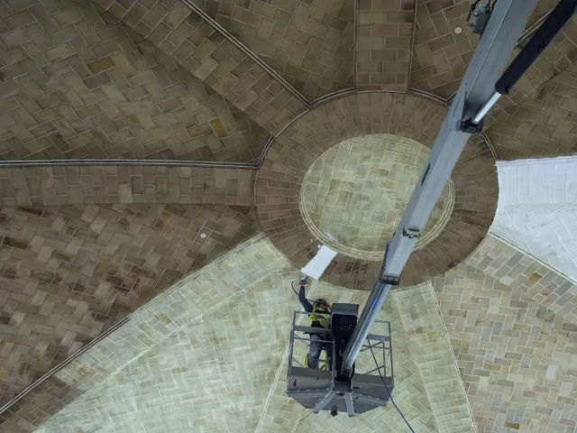 Person working on a ceiling.