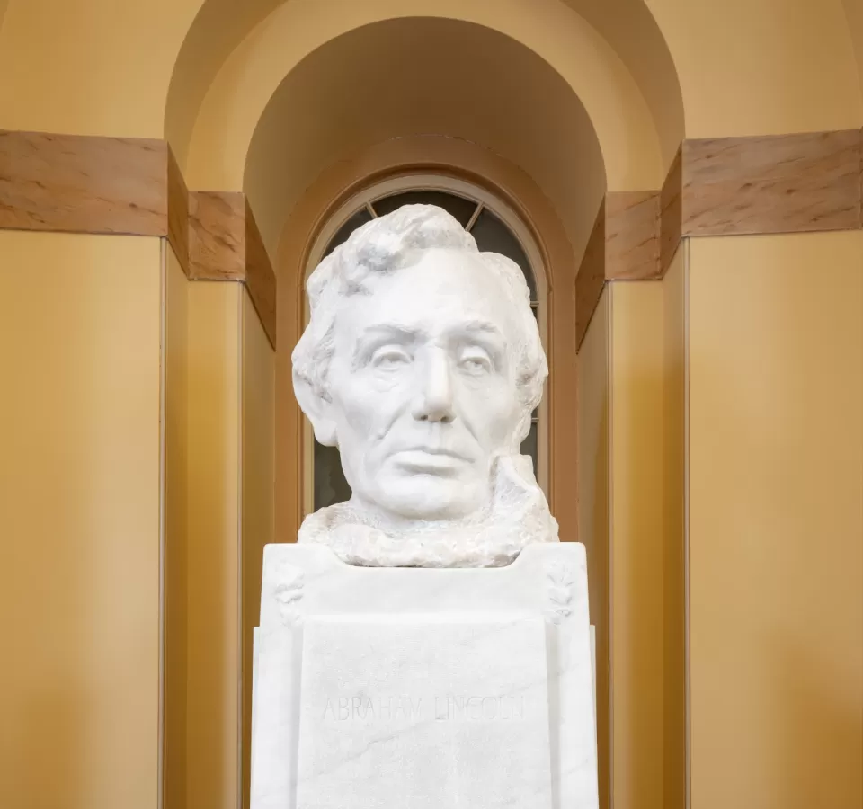 Marble bust on a pedestal.