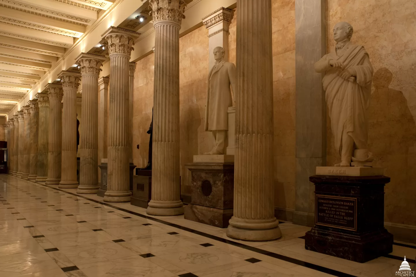 Columns in a room with statues.