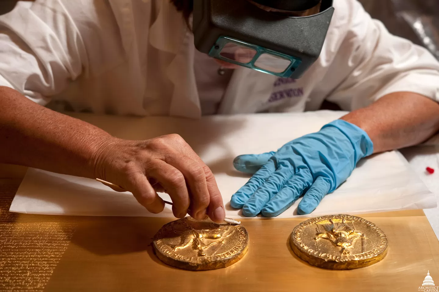 Cleaning the Magna Carta, now on display in the Capitol Crypt; detail of the two medallions depicting the seal of King John.