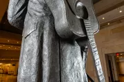 Full view of a guitar in the Johnny Cash statue.