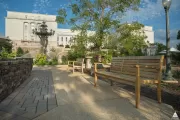 The park includes permeable pavement (left) and new furniture made from locally salvaged white oak.