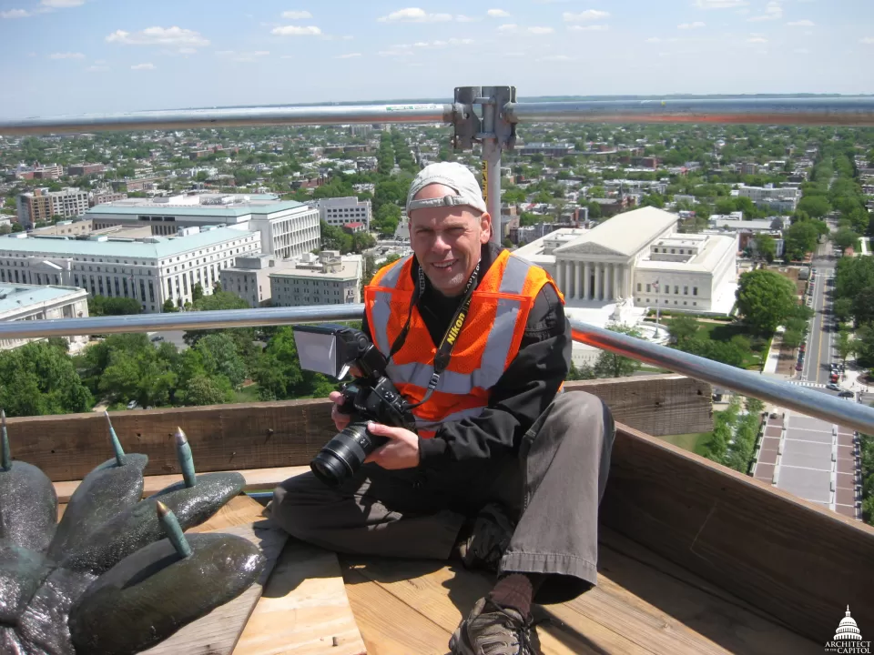 Photographs taken by Badal provide a visual record of the repair work on the U.S. Capitol Dome.