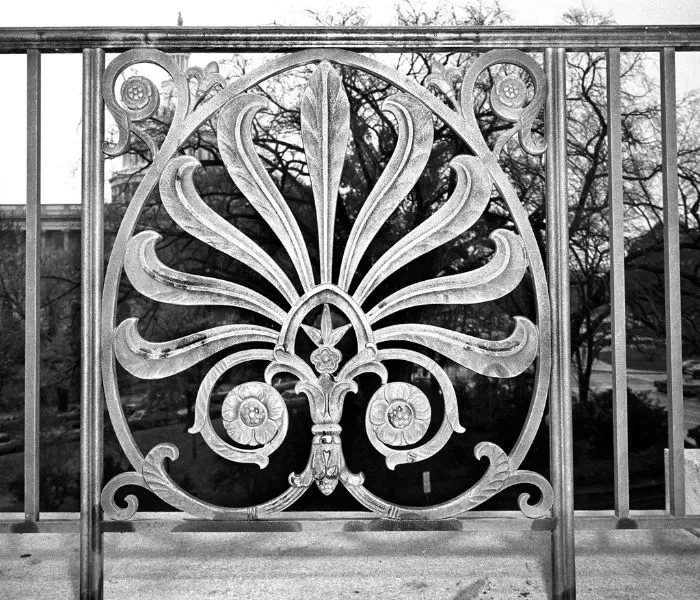 Panel of a bronze Longworth Building railing decorated with a stylized anthemion leaf.