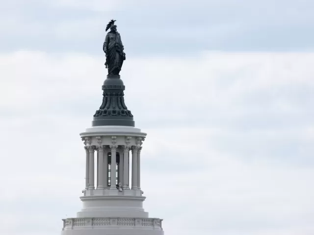 Statue of a figure standing.